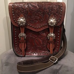Floral tooled lacing saddle bag